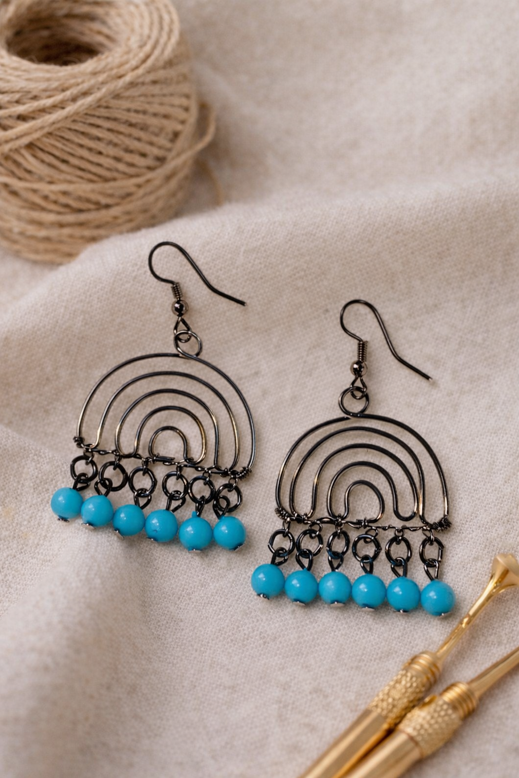 Handcrafted Arc Drop Earrings with Blue Bead Accents